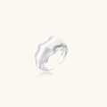 Brushed sterling silver ring with organic wave-like edges and adjustable cuff design on white background